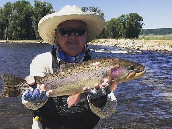 A man holding a fish in his hands.