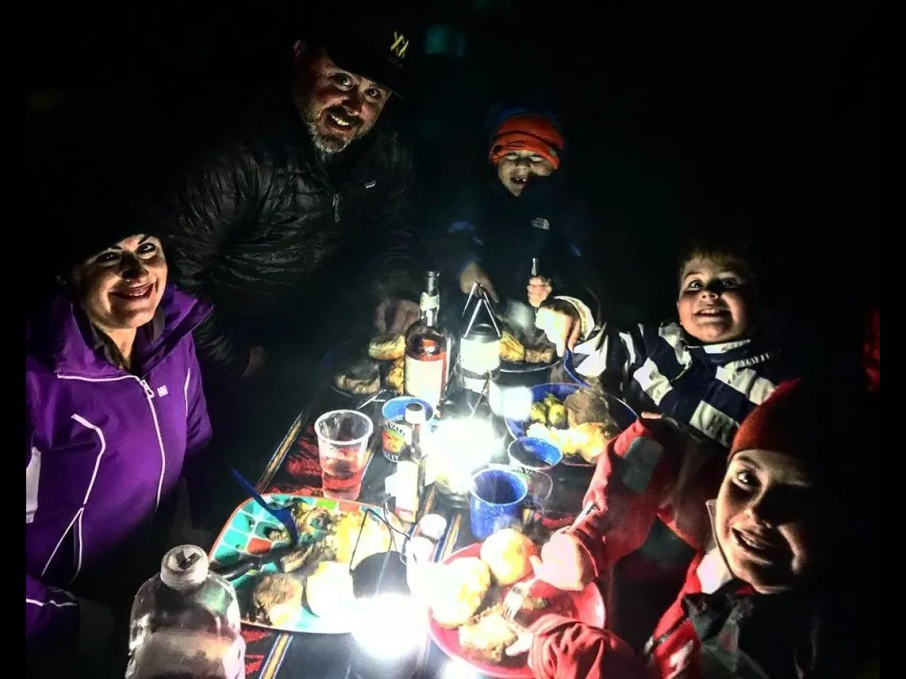 A group of people sitting around a table.