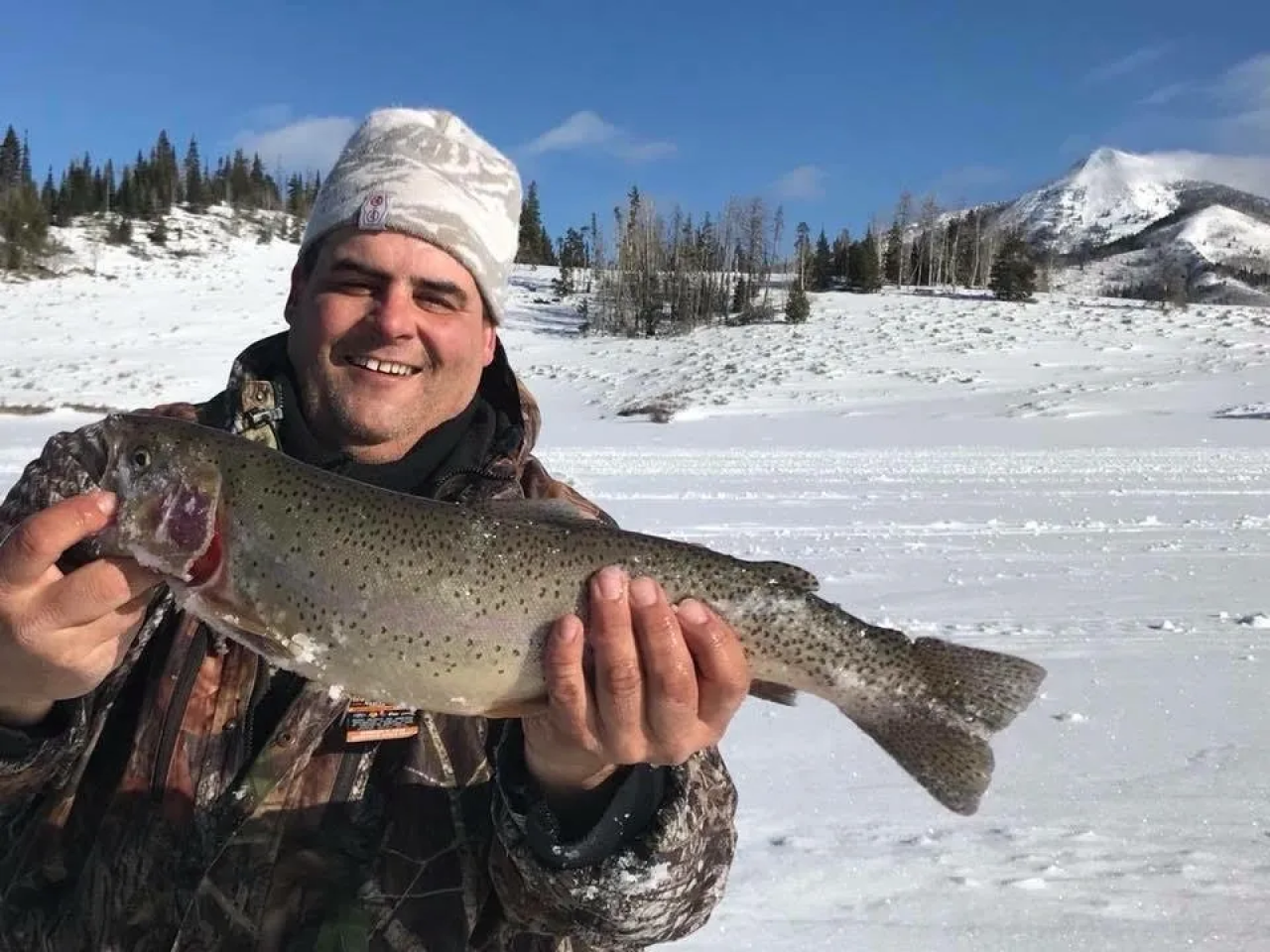 A man holding a fish in his hands.