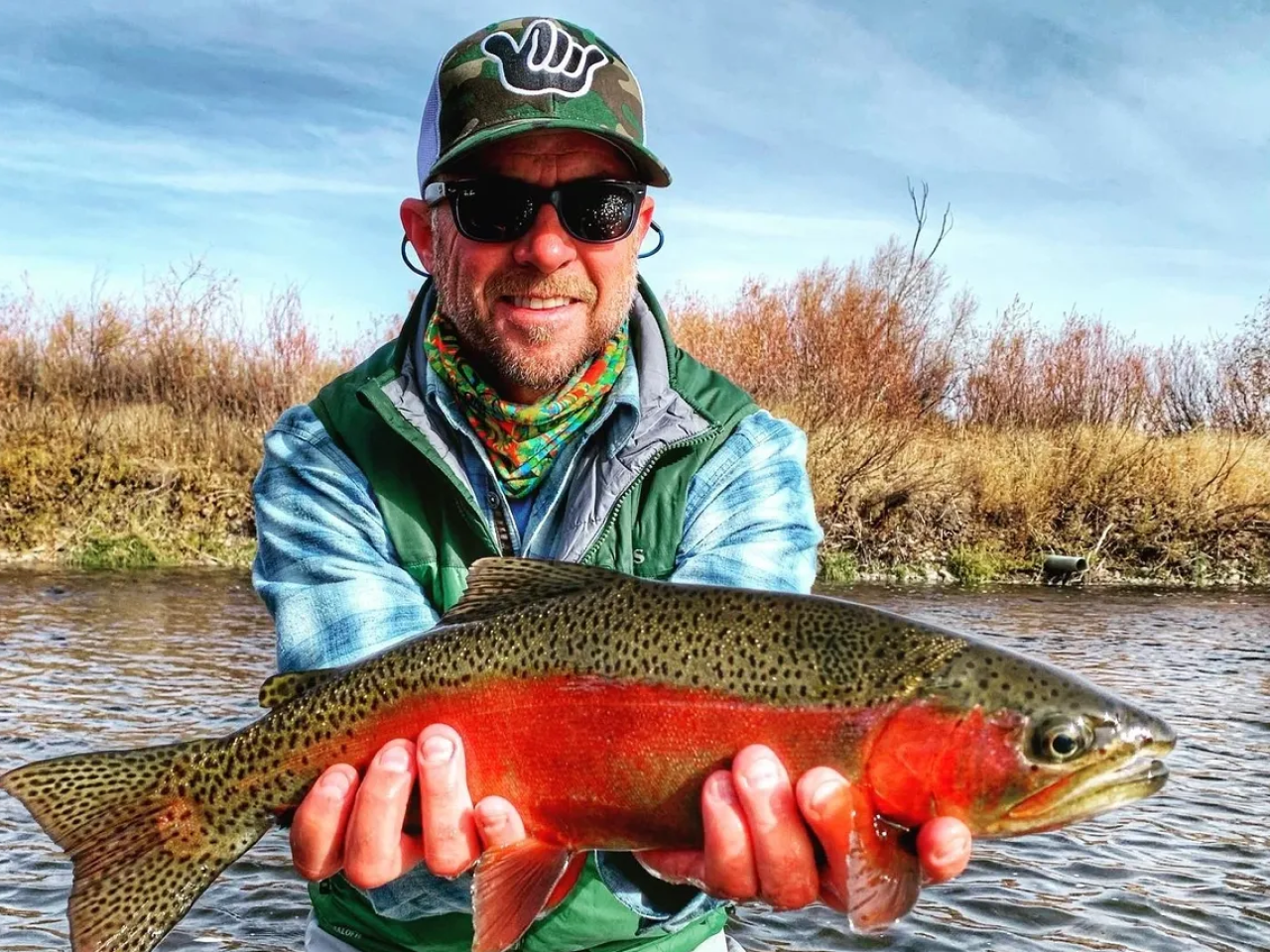 A man holding a fish in his hands.