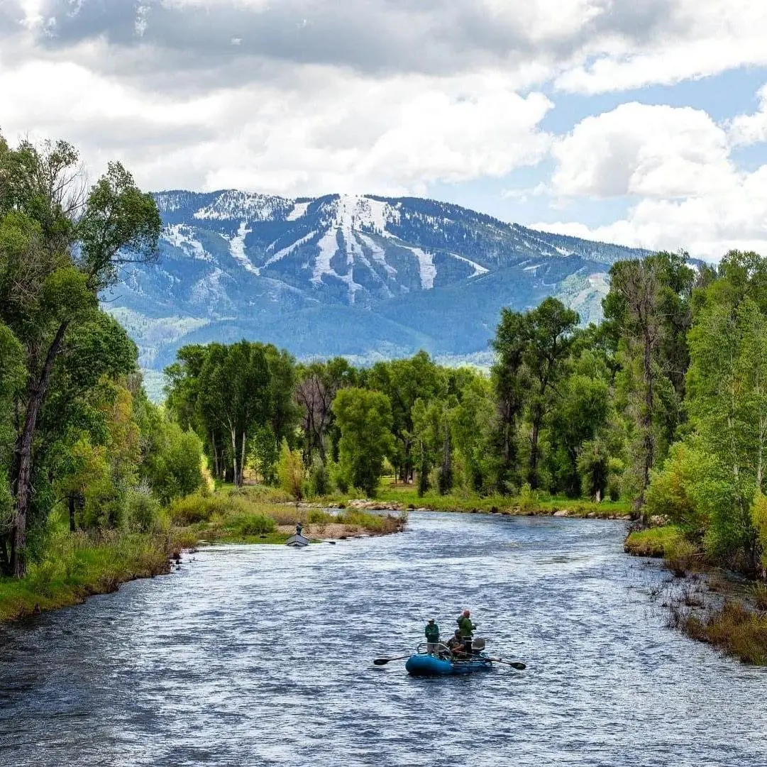 Two people in a boat on the river