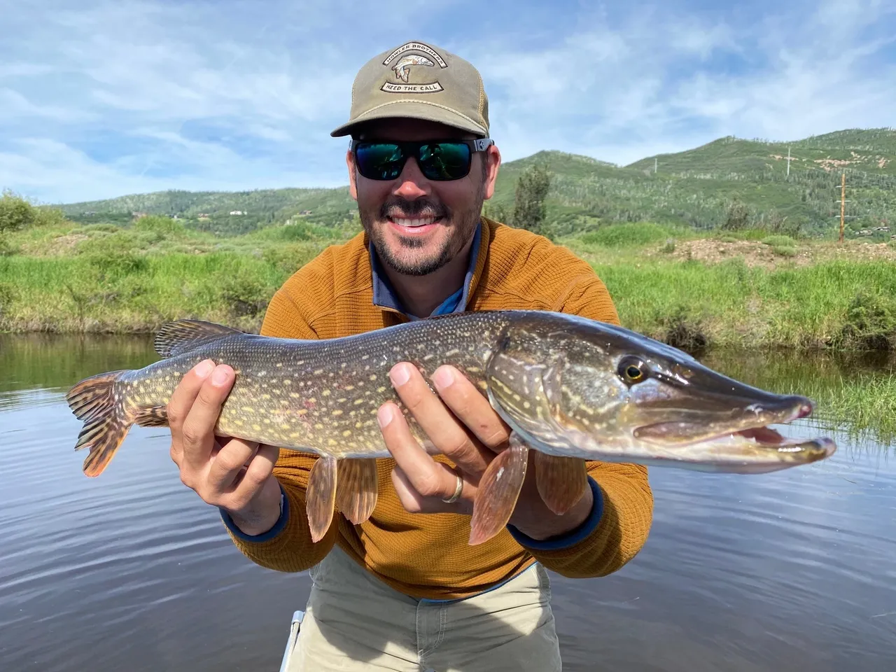 A man holding a fish in his hands.