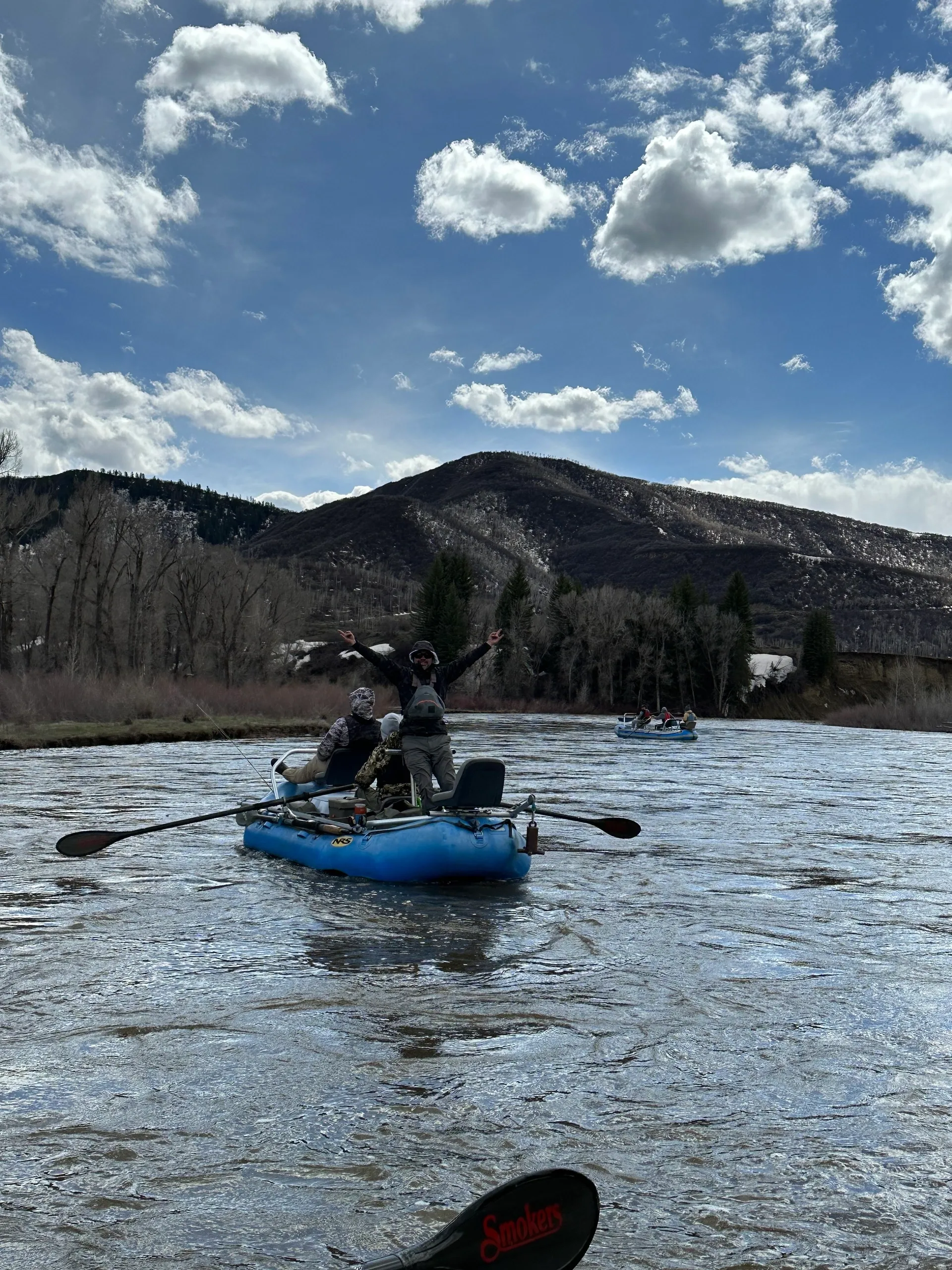 A person in a raft on the water.