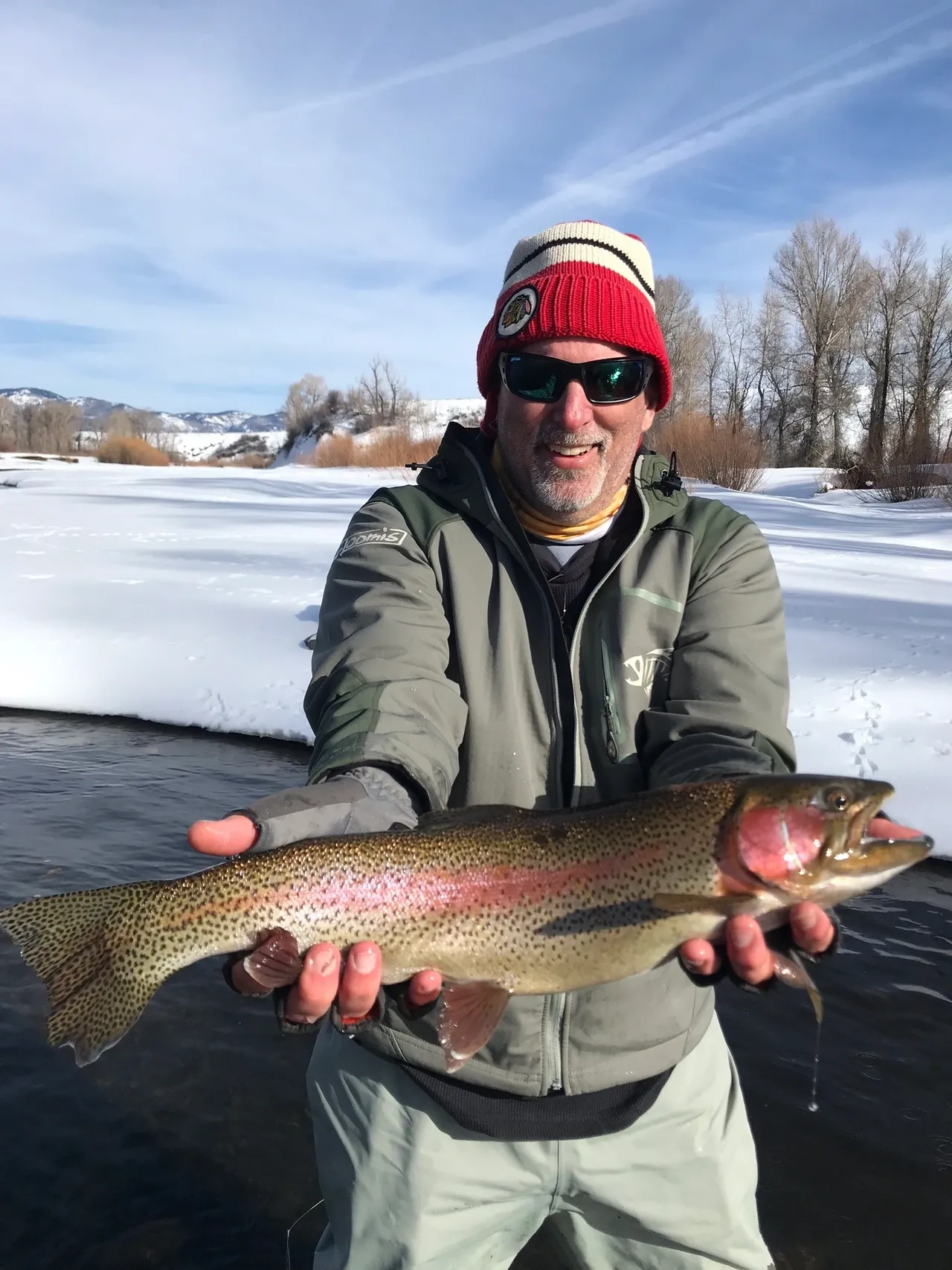 A man holding a fish in his hands.